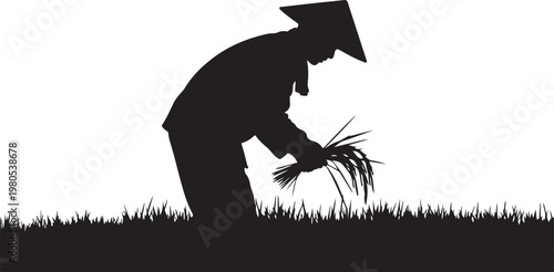 Silhouette of a person planting grass