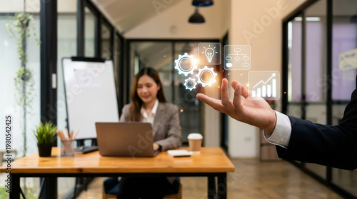 Business concept of growth and teamwork with digital icons showing innovation strategy and success as professional woman works on laptop in modern office environment for corporate development.