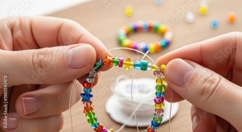 Hands Crafting Colorful Beaded Bracelet CloseUp View.