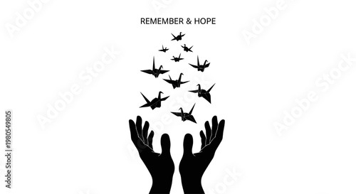 Silhouette of human hands releasing a flock of origami paper cranes for peace.