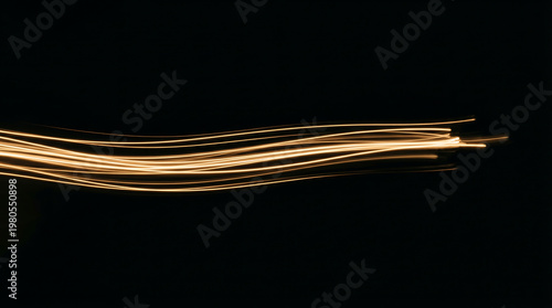 Abstract streaks of light against a dark, textured background