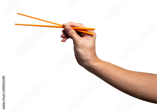 Male hand holding a orange plastic chopstick isolated on white background with clipping path.	
