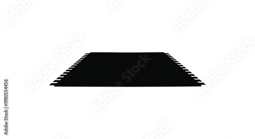 A striking black geometric rug against a white background a bold silhouette