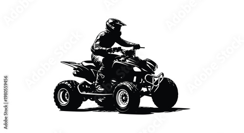A rider operates an all terrain vehicle in a striking black silhouette