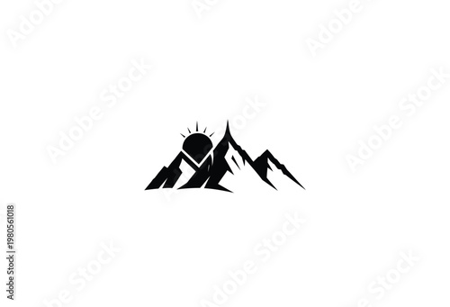 Dramatic mountain range with a rising sun presented in a stark black silhouette