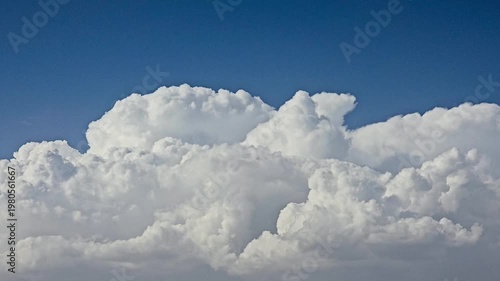 Time-Lapse of Fluffy White Cumulus Clouds Against a Clear Blue Sky