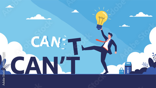 Determined businessman holding glowing lightbulb while kicking away letter T from word CAN'T to reveal CAN.