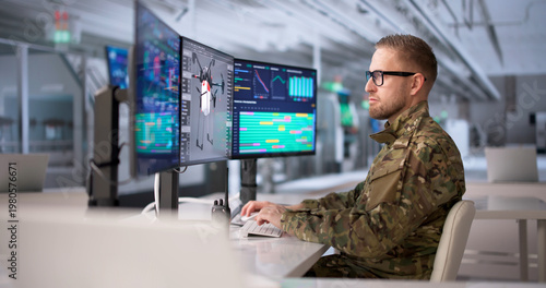 Konstfotografi Engineer Oversees Military Drone Manufacturing Process Via Multiple Computer