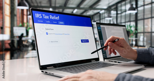Canvastavla Young Man Completing IRS Tax Relief Application Digitally