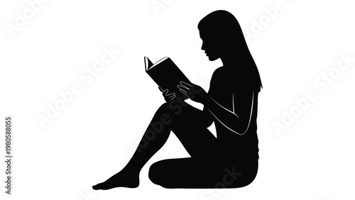 A silhouetted woman is deeply engrossed in reading a book while seated on the floor