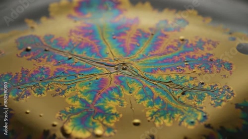 Abstract liquid surface iridescent colors and water ripples