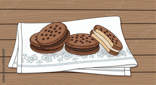 Four sweet cookie sandwiches with chocolate chips and cream on a cloth
