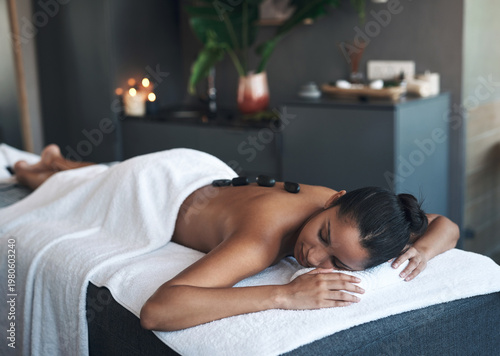 Fotografie Peace, woman or hot stone massage at spa, therapeutic treatment or luxury body care for stress relief