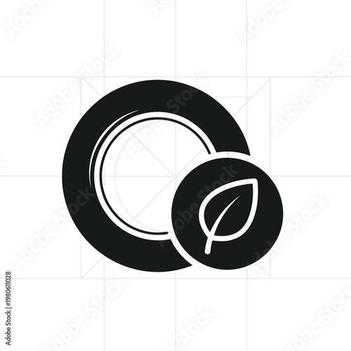 Eco-Friendly Plate: A simple, black-and-white image of a plate with an integrated leaf symbol representing eco-friendliness, perfect for concepts of sustainability and environmental responsibility.