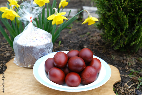 Easter eggs and Easter cake with flowers