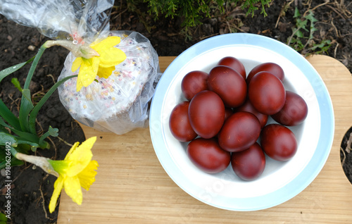 Easter eggs and Easter cake with flowers
