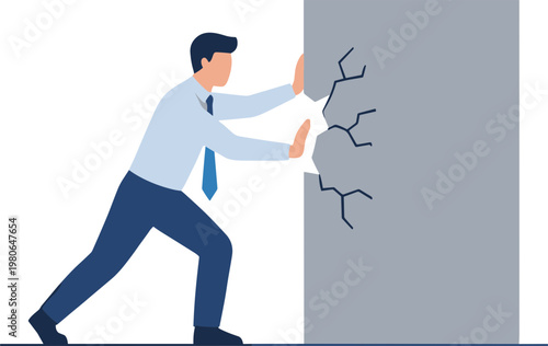 Man pushing against a cracked wall with effort and determination in office