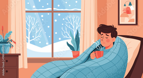Sick man wrapped in a blue blanket sits in an armchair holding a hot mug while watching snow fall outside his window during winter season.