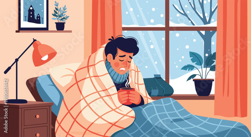 Man feeling sick with a cold or flu is resting in bed wrapped in blankets and holding a hot cup of tea on a snowy winter day.