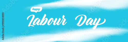 Happy Labour Day lettering on blue sky background. Wide panorama banner with white clouds and elegant script Labor Day typography. Modern header for 1 may international workers day and Mayday