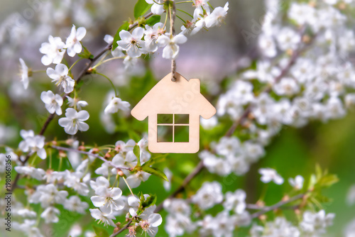 Wallpaper Mural symbol of the house among the white cherry blossoms
 Torontodigital.ca