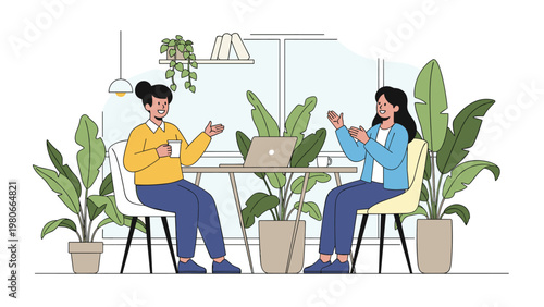 Two professional women enjoying a friendly business meeting and collaboration over coffee in a bright modern workspace.