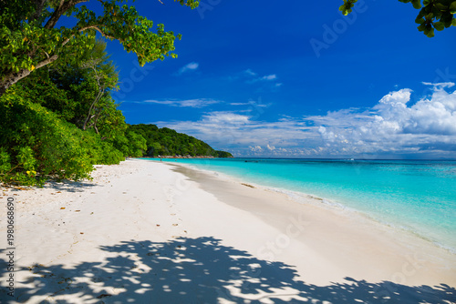 Beautiful crystal clear sea and white sand beach with boat at Tachai island, Andaman, Thailand