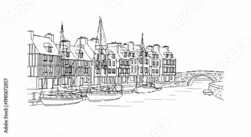 Waterfront buildings with sailboats moored along a canal, stone bridge overhead