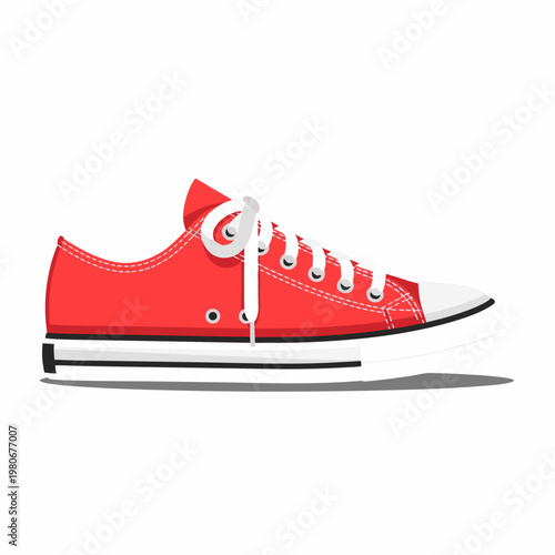 Red canvas sneaker laced resting on white studio background