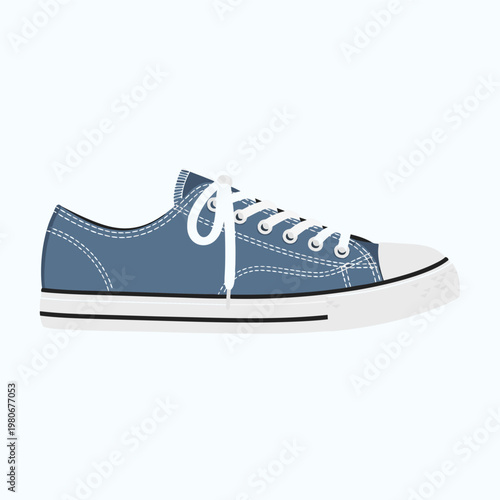 Blue canvas sneaker tied resting on white background