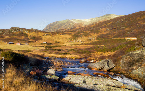 The River Rysna Running through Rysndalen Valley in Vang Municipality, Norway, with Gronstolane and Torstadstolen
