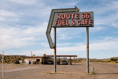 Vintage Route 66 Fuel and Cafe Sign in the Arizona Desert. Classic American Road Trip Landmark with Gas Station and Blue Sky.