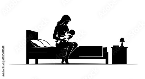 Silhouette of a mother breastfeeding her newborn baby on a bed at night.