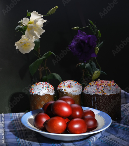 Easter eggs and Easter cake with flowers