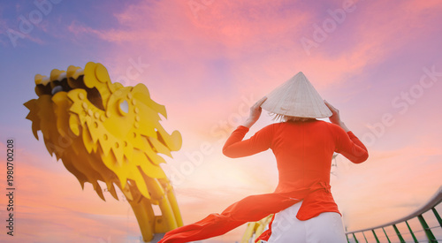 Bild auf Leinwand Tourist woman in traditional red dress on background Dragon bridge over Han rive