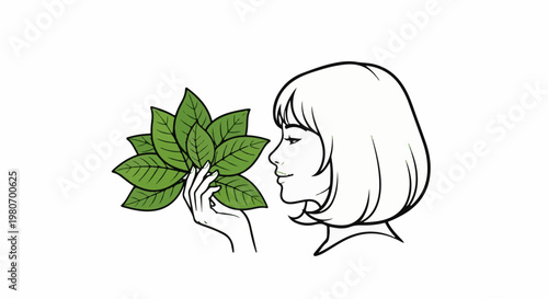 Woman in profile smelling green leaves held in hand