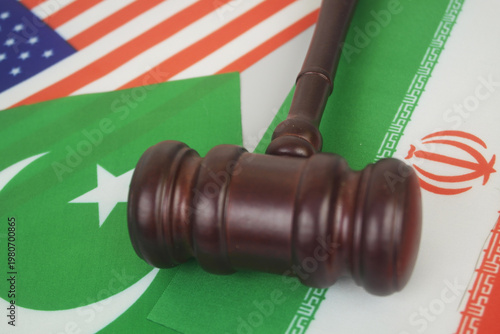 Flags of America, Pakistan and Iran with judge gavel. Negotiation of USA and Iran in Pakistan.