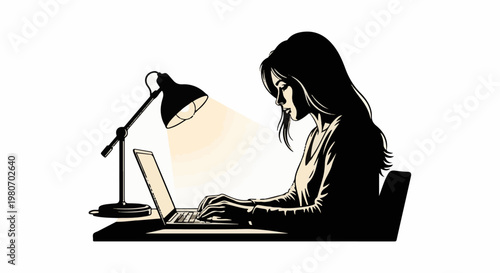 Woman working on a laptop at a desk with a desk lamp illuminating the scene