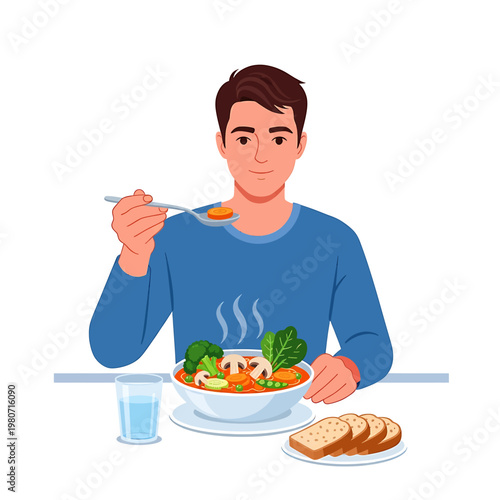 Man eating soup with bread plate.