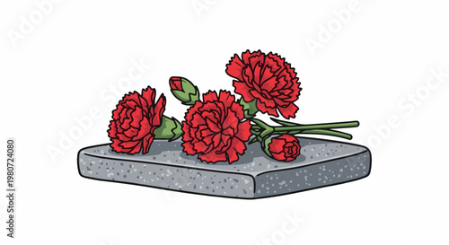 Red carnations lie on a grey stone block against a white background
