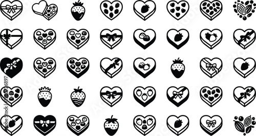 Collection of heart shaped chocolate boxes and strawberries are arranged in a pattern