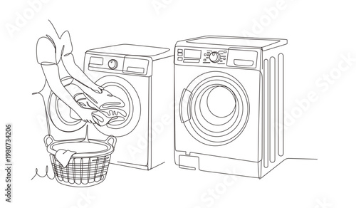 Continuous line drawing of a modern washing machine and laundry basket vector illustration vector	