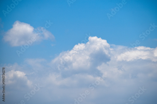 Beautiful clear blue sky with puffy white clouds. Thick cloud cluster. Relaxing view, beautiful day. Good weather condition.