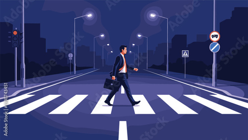 Professional businessman in a suit carries a briefcase while walking across a crosswalk on a quiet city street at night.