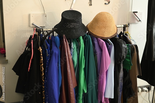 Rack with different stylish women`s clothes 