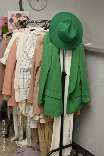 Rack with different stylish women`s clothes 