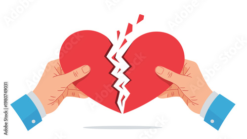 Close up of hands pulling apart a broken red heart to symbolize heartbreak relationship failure or emotional pain.