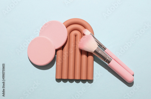 Obraz na płótnie Set of makeup products with podium on a blue background