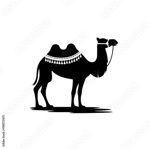 Black silhouette of a camel with ornate saddle standing proudly