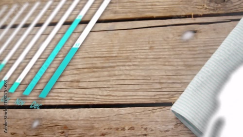 Camera panning over top revealing bowl and napkin while teal charts expanding over bowl for food